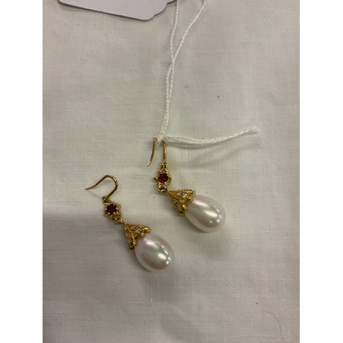 217 - A pair of 18ct gold natural pearl, diamond and ruby set earrings