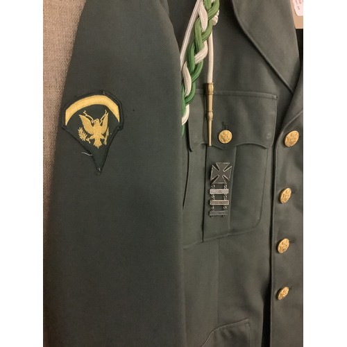 309 - An American Army Special Forces uniform jacket is 40L, trousers waist 30