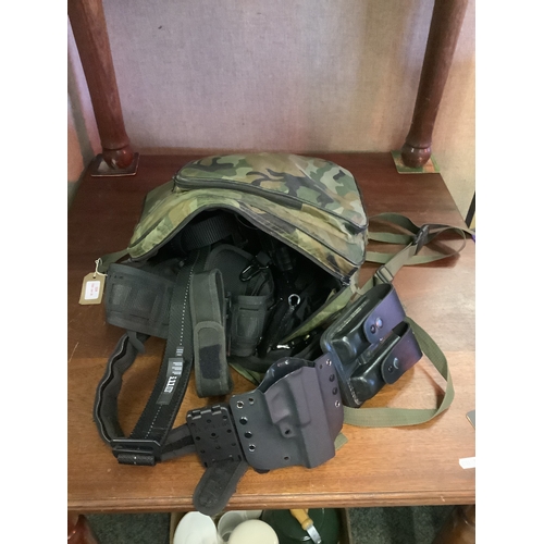 324 - A military back pack with holsters