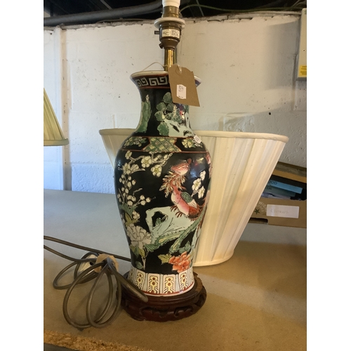 332 - An Oriental lamp having Geisha floral and birds decoration with shade