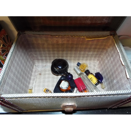 345 - A vintage vanity case and a selection of assorted perfume bottles