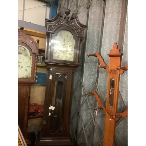 440 - A 19thC large oak cased Grandfather clock having silvered dial eight day movement with tubular bells... 