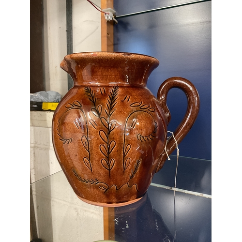 53 - A large brown glazed Staffordshire jug with single handle