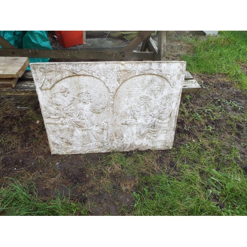 517 - A plaster garden wall plaque with toper decoration