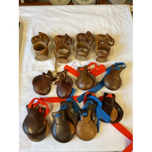 102 - A mixed selection of treen items to include four elephant napkin rings and castanets