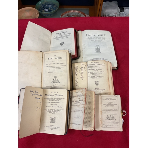 111 - A selection of leather bound Bibles and Common Hymn books