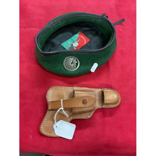 129 - A French Airbourne beret with badge attached together with a leather holster