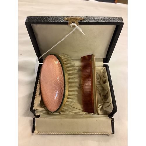 170 - A vintage boxed enamel brush and comb set