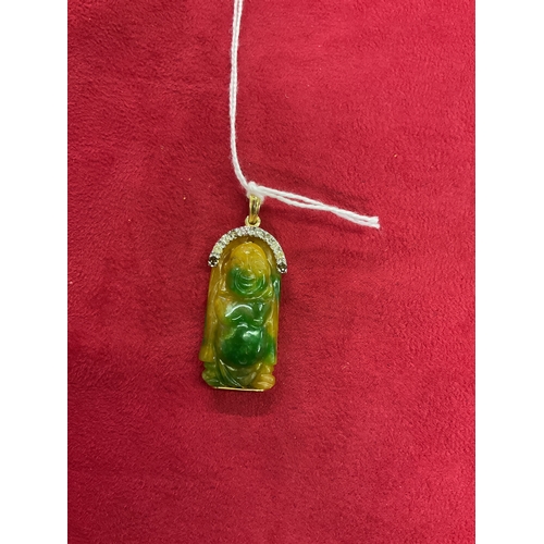 201 - A natural carved Jade Buddha pendant with 18ct gold mounts and diamond bail