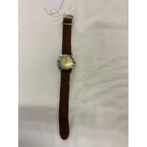 215 - A Gradus Quartz wristwatch with brown strap