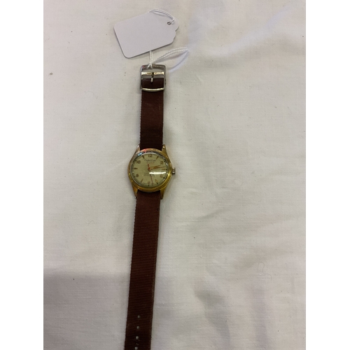 216 - A Le Locke/ Tissot wristwatch with fabric strap