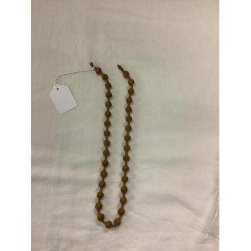 223 - A vintage carved wooden beaded necklace