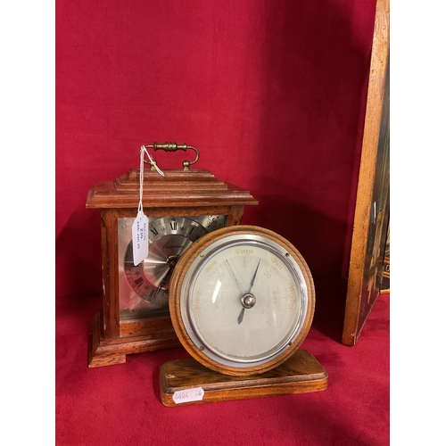 230 - An oak cased mantel clock and barometer