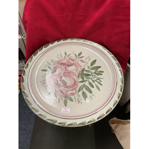 33 - A large heavy charger with floral and leaf decoration signed Tarquin Cole 20 1/2