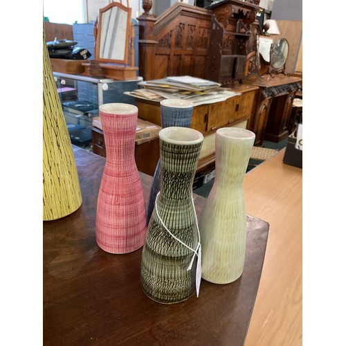 144 - A Harlequin group of four Rye Pottery mid-century long neck vases