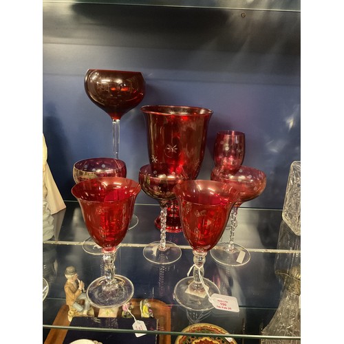 150 - A mixed selection of assorted ruby red glass ware to include vase, twisted stem glasses etc