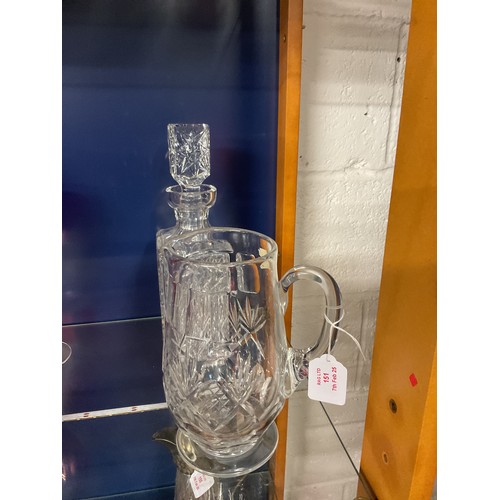 151 - A crystal cut glass decanter together with a jug