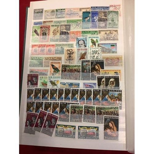 177 - Am album housing a large collection of New Zealand stamps