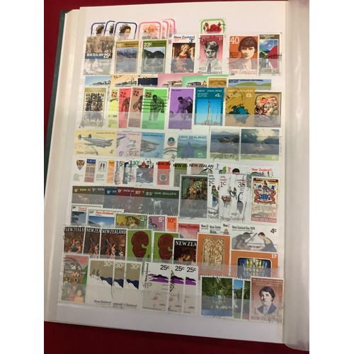 177 - Am album housing a large collection of New Zealand stamps