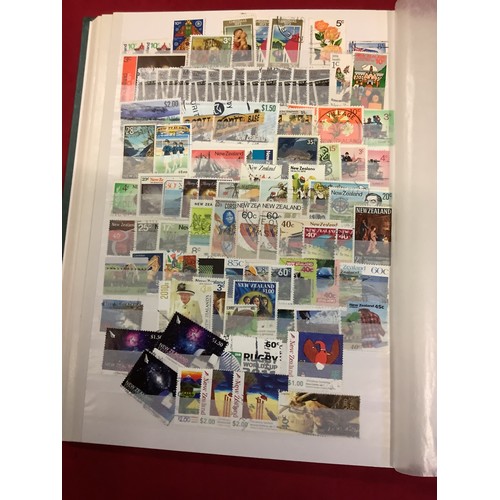 177 - Am album housing a large collection of New Zealand stamps