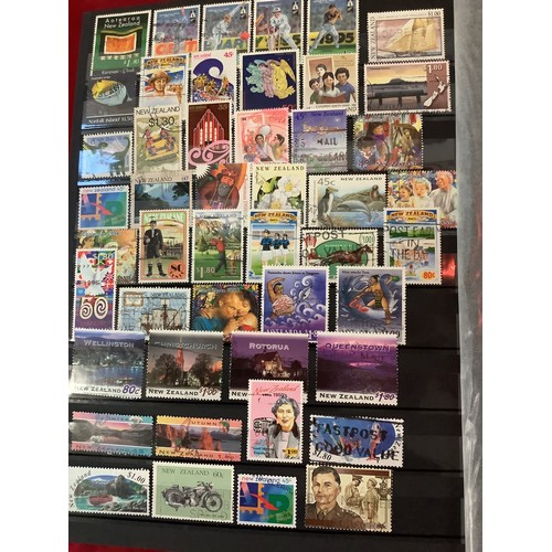 198 - An album housing a large selection of New Zealand stamps mint and used dating from 1857 to 1996