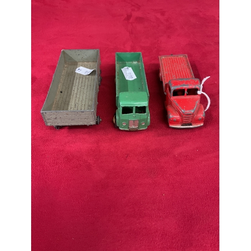 217 - A Dinky die-cast play worn Fordson lorry together with another green lorry and trailer