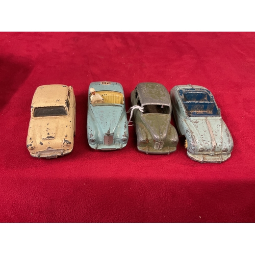 227 - Four Dinky die-cast play worn vehicles to include Austin Cambridge, Austin Atlantic, Sunbeam Alpine ... 