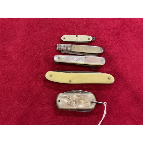 264 - Four vintage small penknives and a Georgian silver fruit knife