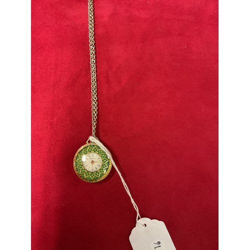 334 - A ladies gold tone and green enamel fob watch on chain