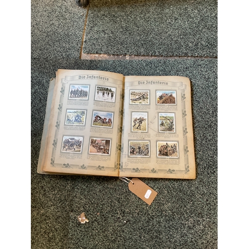 185A - A WWII German collecting cards book and Armed Forces