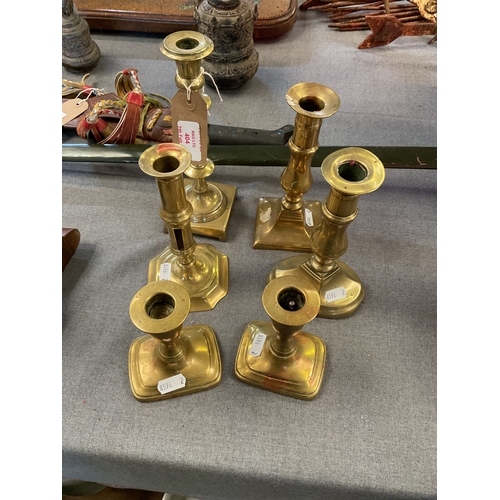 404 - Six vintage brass candlesticks