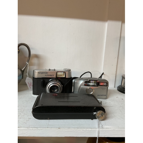 473 - A vintage Voigtlander Vitoret camera, an Olympus NewPic XBAF and a TI Coronet