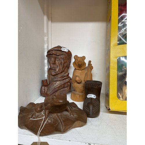 484 - A selection of treen items to include carved wooden frog, Old Gentleman, Bear and a wooden shoe