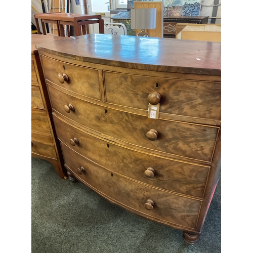 621 - A Victorian mahogany bow front chest of two short over three long graduating drawers with turned han... 