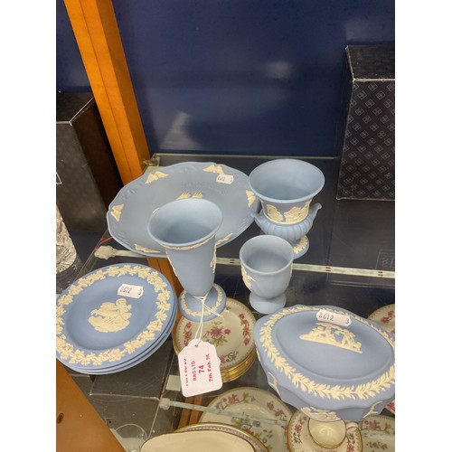 74 - A selection of blue Wedgwood Jasper ware to include lidded pot, vases, plates etc