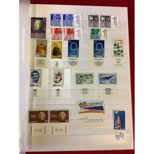 126 - An album housing a selection of stamps unmounted and some mint to include Israel, Palestine, etc