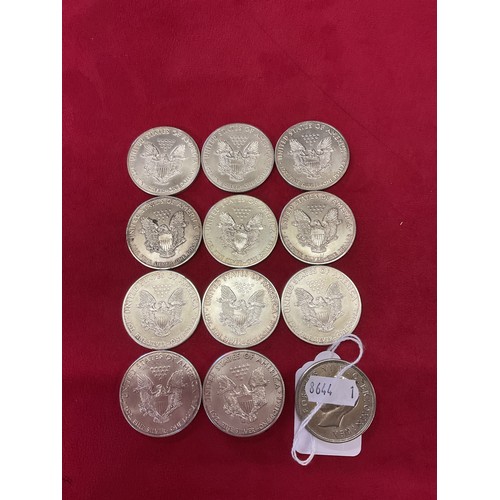 235 - A selection of U.S.A silver 1 dollar coins (11) and a 1937 crown