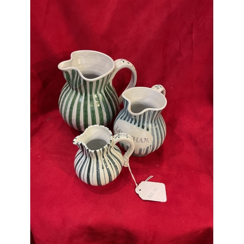 71 - Three Rye Pottery cottage stripe graduating jugs in green, black and blue