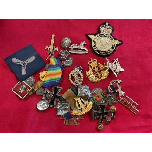 169 - A box of military badges