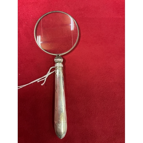 257 - A silver handled magnifying glass