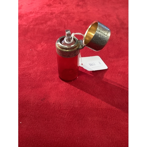 254 - A ruby red glass perfume bottle having Birmingham silver collar