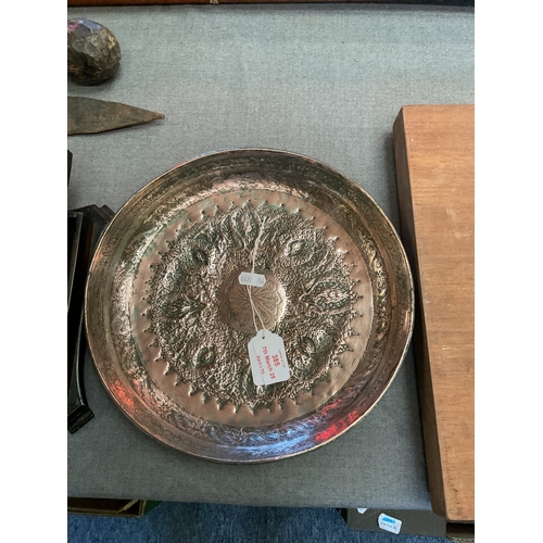 385 - A tinned copper Middle Eastern round dish with peacock design