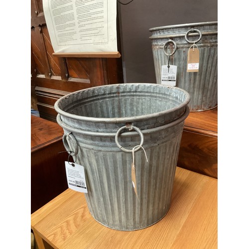 560 - A pair of galvanised garden planters