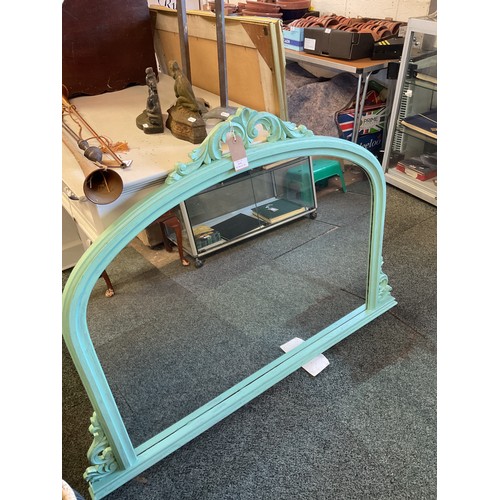 616 - A green painted arch top over mantel mirror