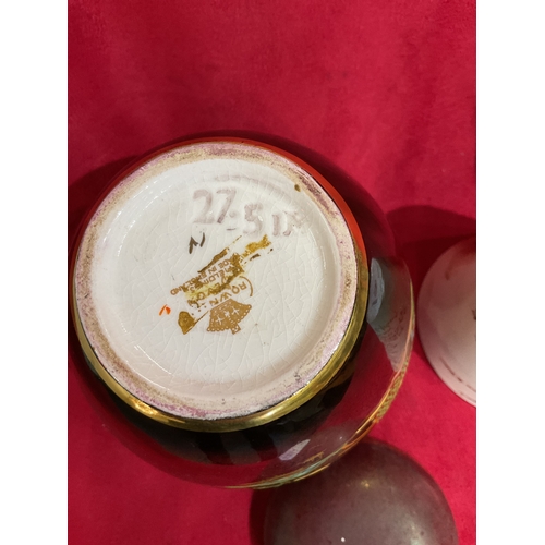 25 - A Macintyre 'The Absent Minded Beggar' cup A/F and a Crown Devon rouge royal ginger jar