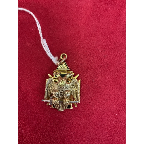 303 - A Masonic gold and enamel folding pendant