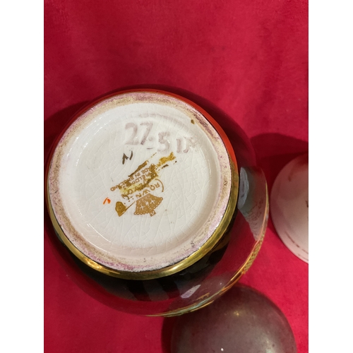 22 - A Macintyre 'The Absent Minded Beggar' cup A/F and a Crown Devon rouge royal ginger jar
