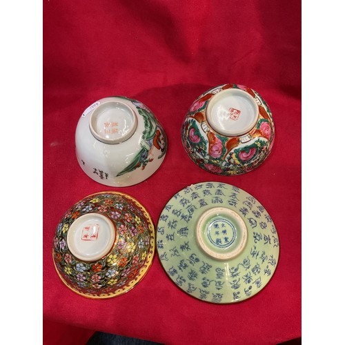 61 - Four assorted Chinese tea bowls with character marks to base