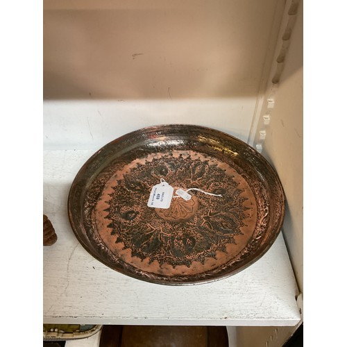 459 - A tinned copper Middle Eastern round dish with peacock design