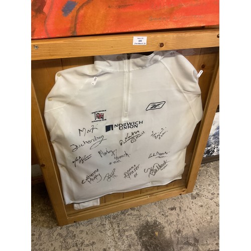 480 - A framed Great Britain signed tracksuit from 2000 Sydney Olympics signatures to reverse